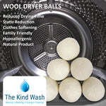 Six wool dryer balls inside tumble dryer — natural biodegradable fabric softener alternative
